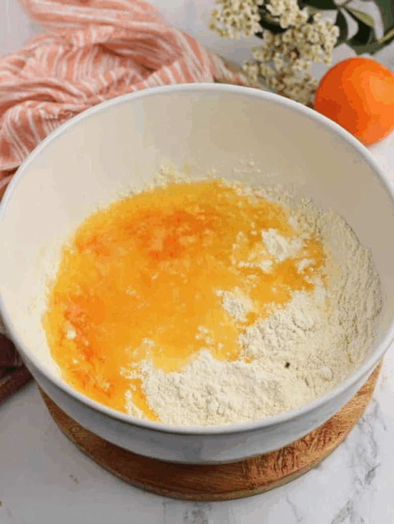 Whisking orange muffin batter with zest