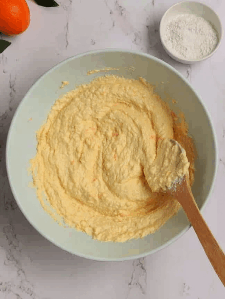 Whisking orange muffin batter with zest